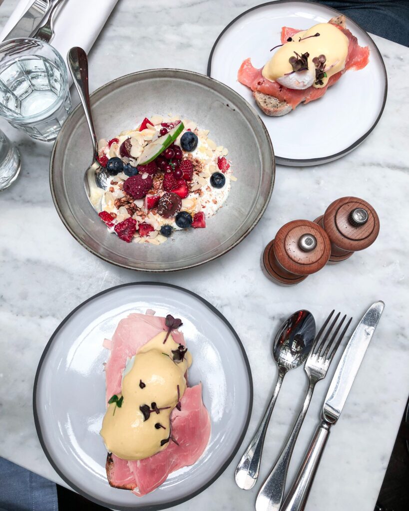 Eggs Benedict on White and Black Ceramic Plates